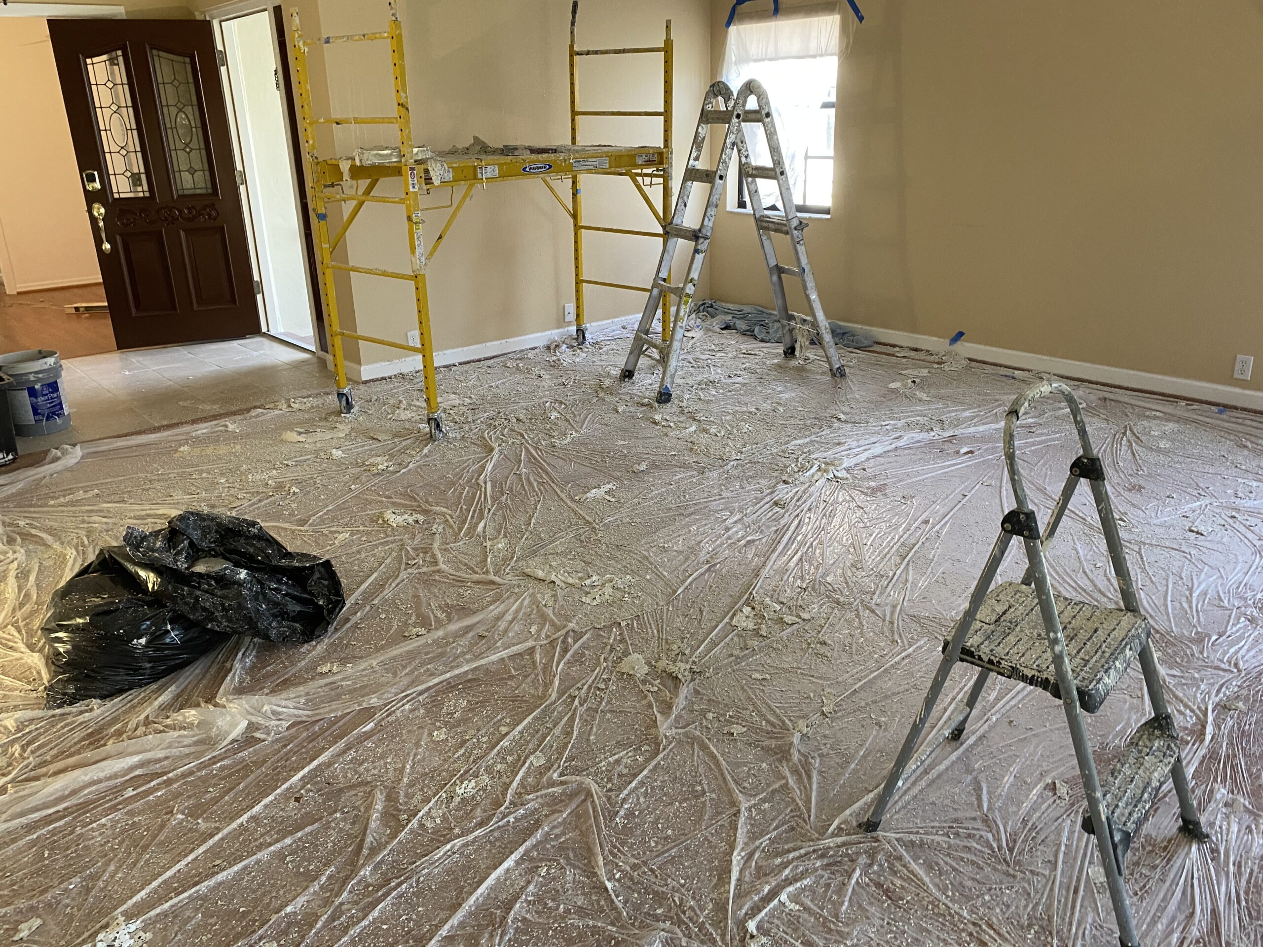 Messy way of removing popcorn ceiling in Sarasota